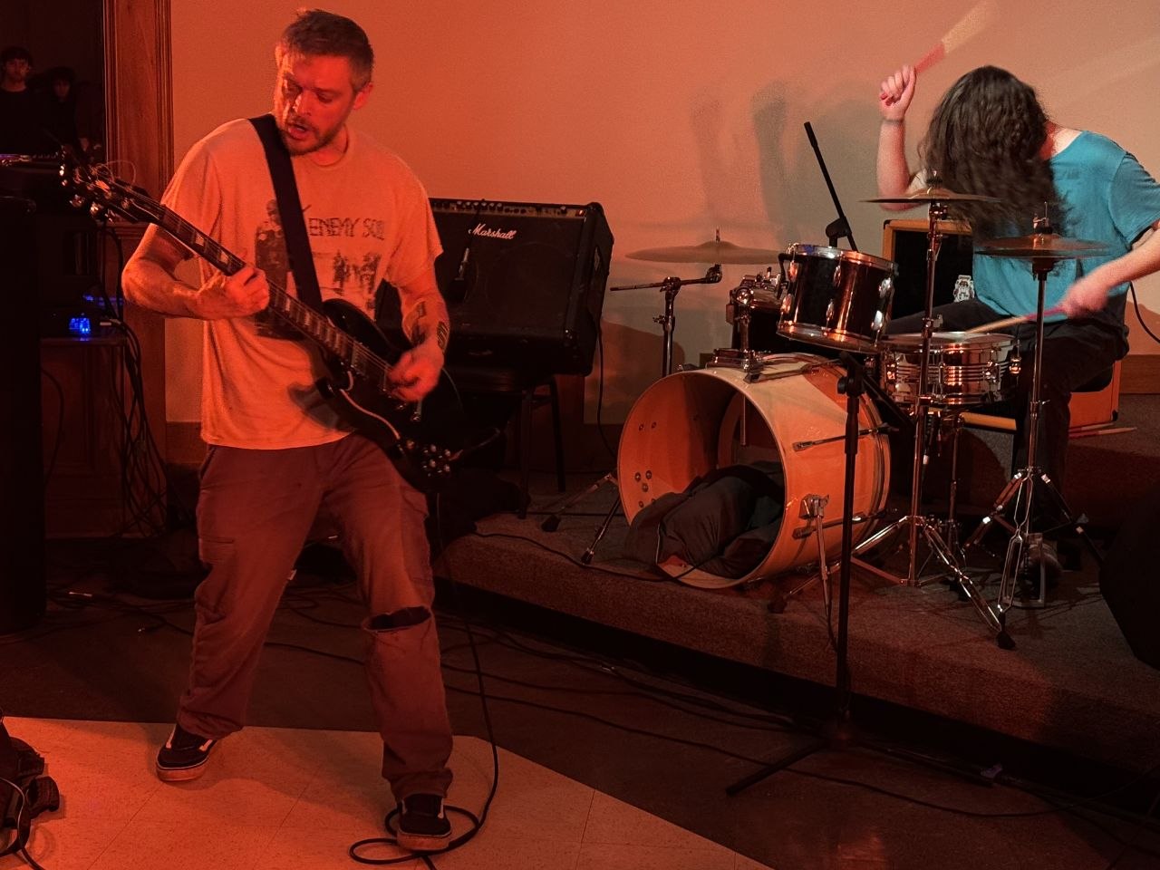 Full stage shot in color, both members playing live